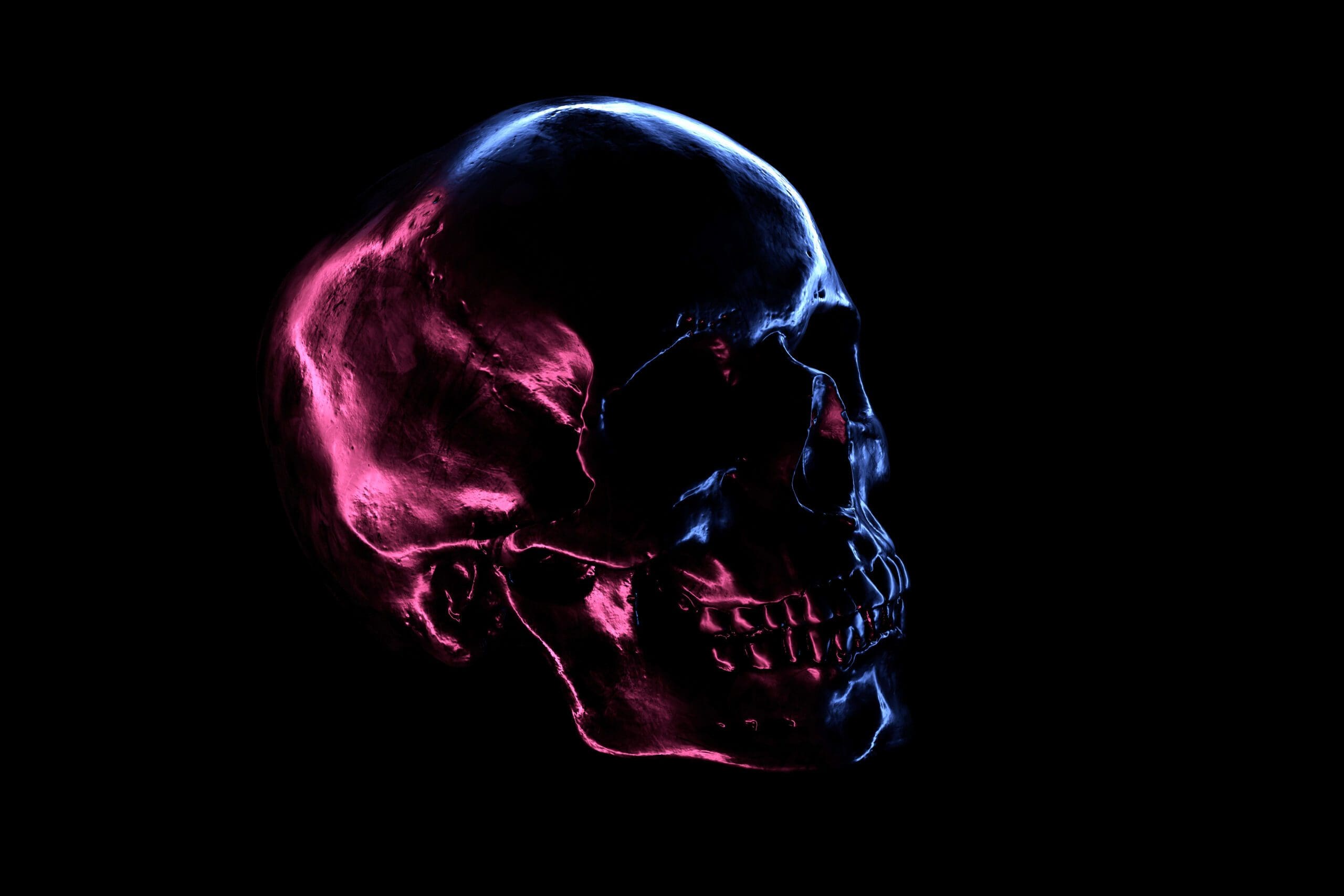 A metallic skull with neon reflection symbolizing the intersection of necropolitics and ai